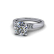 White gold engagement ring with round solitaire diamond and side accent stones