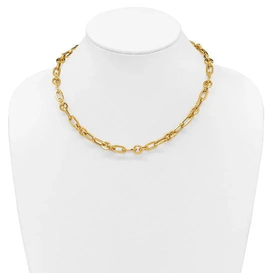 Gold chain link necklace displayed on a white jewelry bust