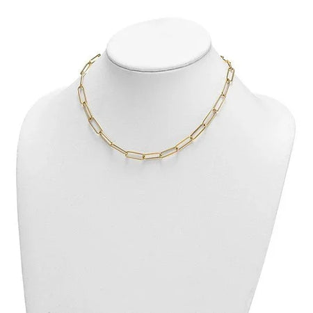 Gold paperclip link chain necklace displayed on a white jewelry mannequin bust