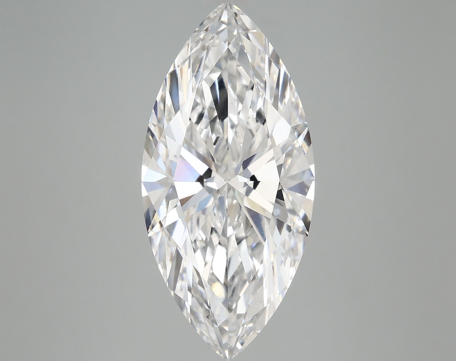 Marquise cut diamond gemstone with brilliant facets on a light gray background