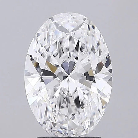 Oval cut diamond loose stone with brilliant facets on a light gray background