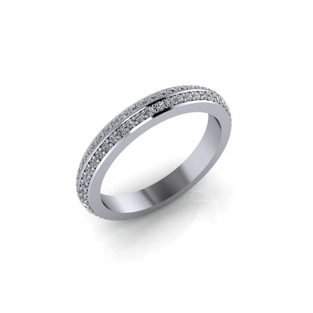 White gold diamond eternity band with double pavé rows on a plain background
