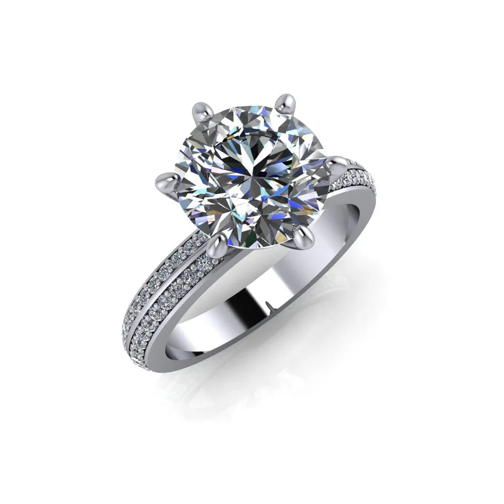 Custom engagement ring with large round center diamond and pavé band on white background