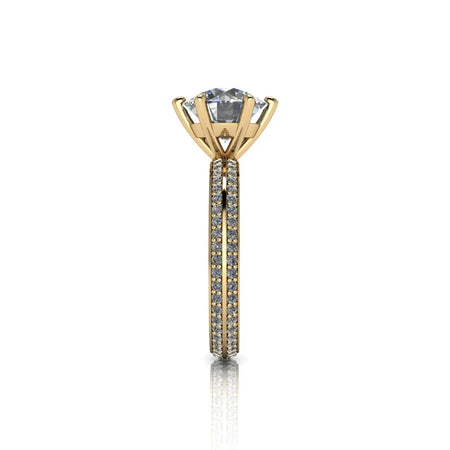 Yellow gold solitaire engagement ring with pavé diamond band, side view