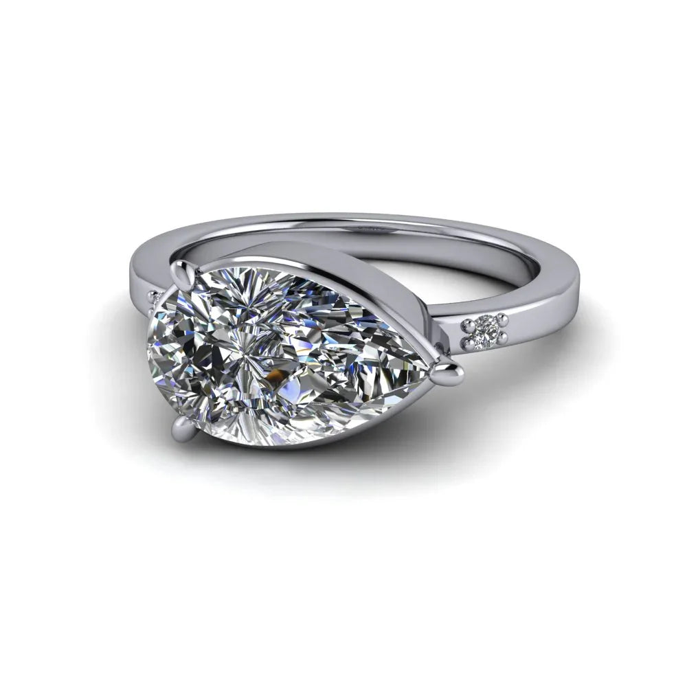 Pear-shaped diamond engagement ring with side accent stones on white gold band