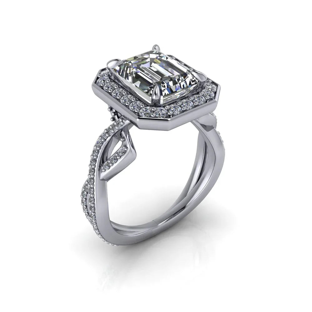 Emerald cut diamond engagement ring with halo setting and intricate pavé band