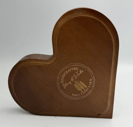 Heart-shaped wooden jewelry box with engraved handcrafted logo on front