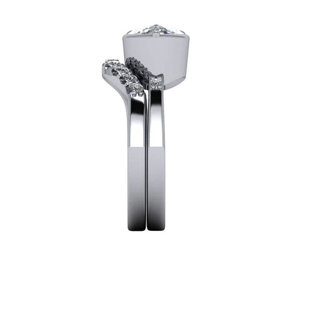 Side view of a custom diamond engagement ring set with pavé band details