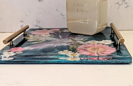 Handcrafted floral resin vanity tray by Stacy K Studio with gold handles and pressed flowers.
