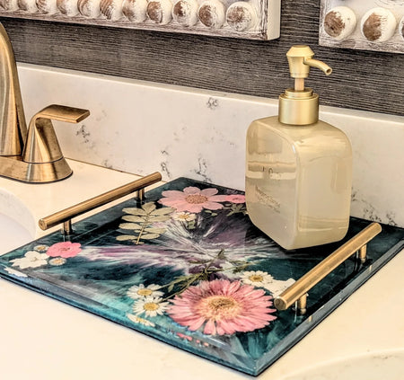 Stacy K Studio handcrafted floral resin vanity tray with gold handles on a bathroom counter