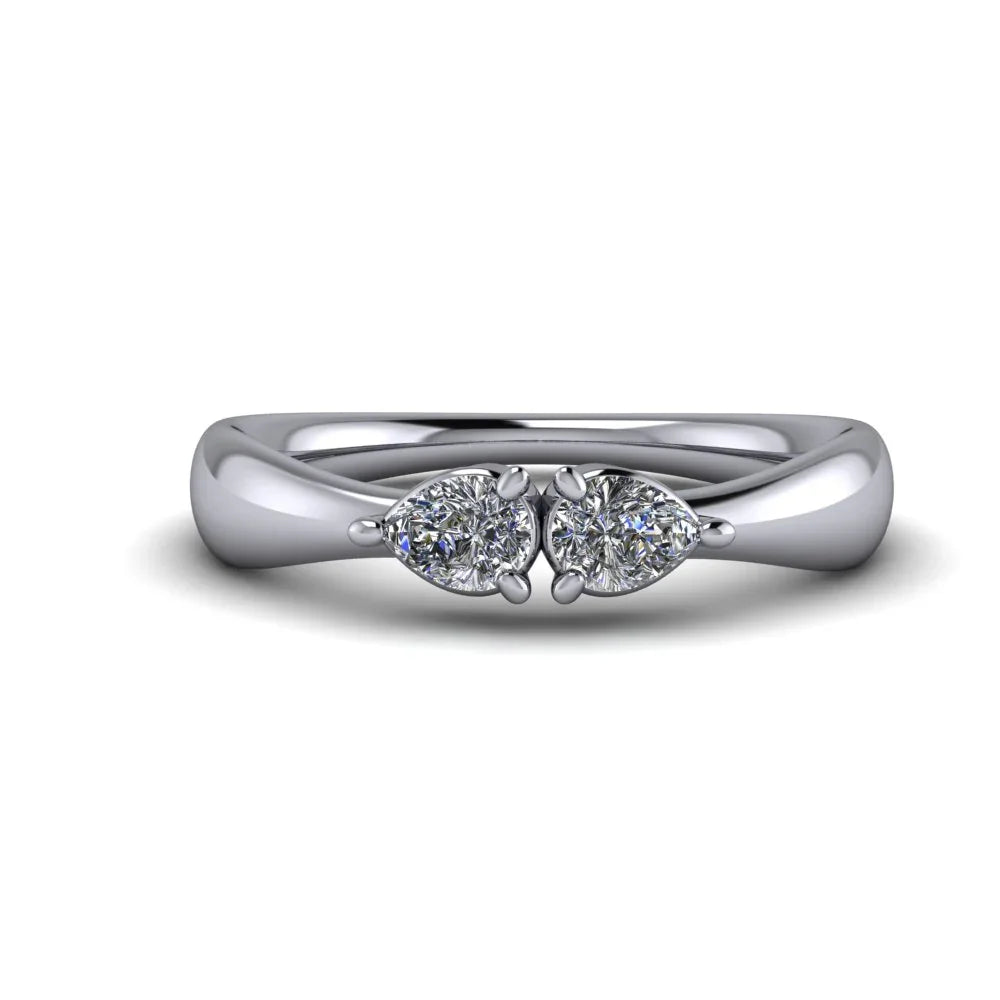Custom white gold ring with two pear-shaped diamonds on a polished band