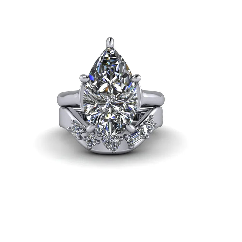 Pear-shaped diamond engagement ring with matching diamond band in white gold setting
