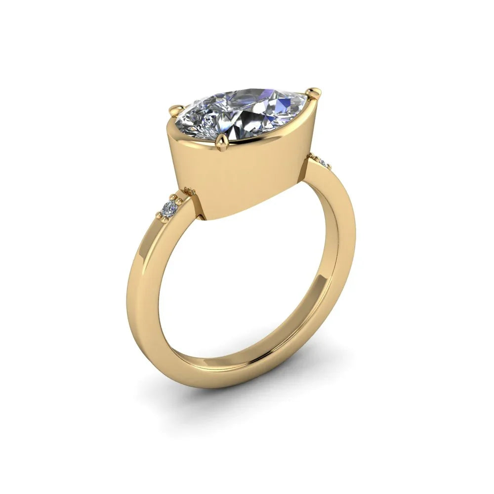Yellow gold engagement ring with large oval diamond and small side stones on white background
