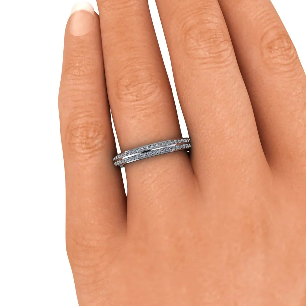 White gold diamond eternity band on hand, custom-made engagement or wedding ring
