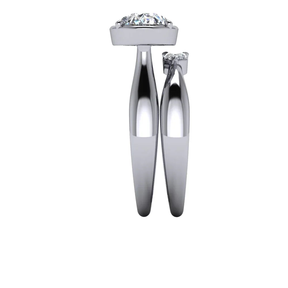 Side view of two white gold diamond engagement rings with solitaire settings on white background