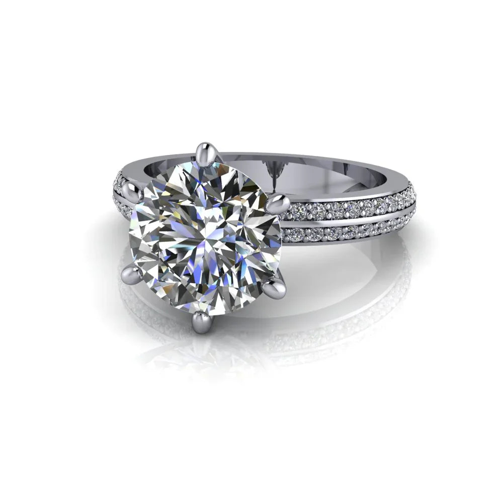 Round cut diamond engagement ring with pavé band in white gold on white background