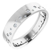White gold wedding band with scattered round diamonds set in a modern design
