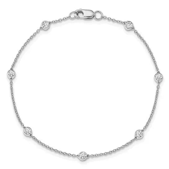 Delicate white gold bracelet with bezel-set round diamonds on fine chain