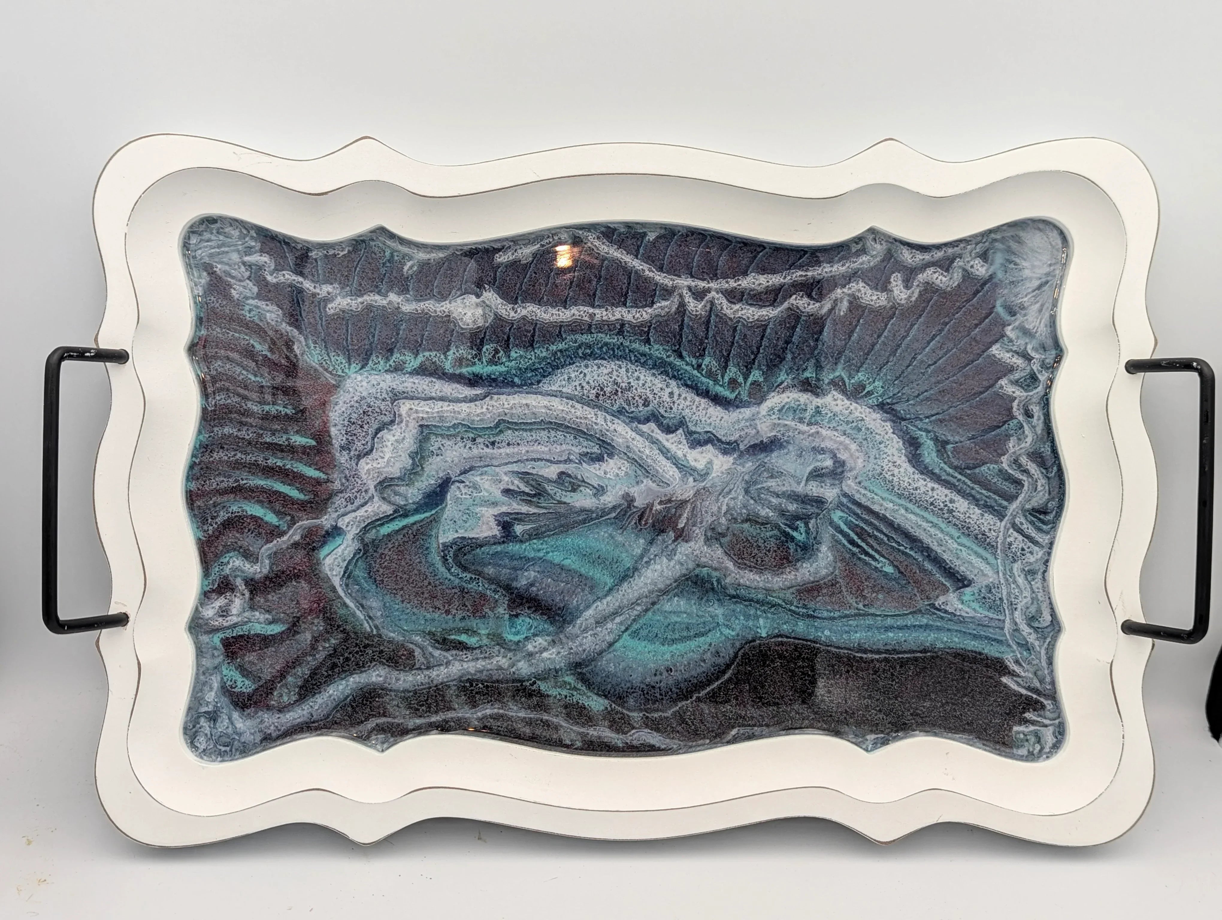 Handcrafted resin art tray with abstract teal, black, and white marbled design, black handles