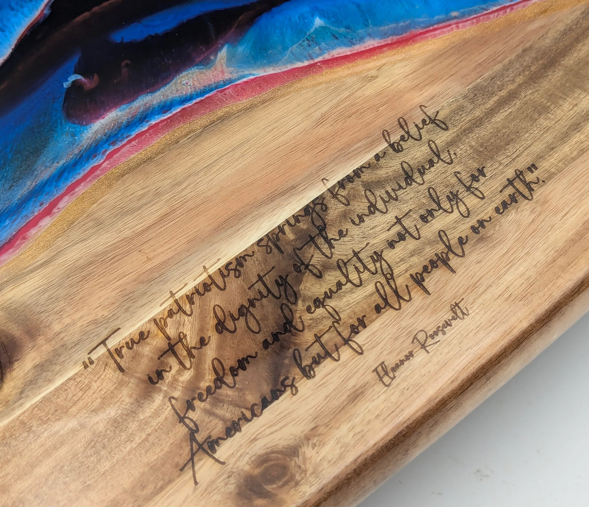 Wooden board with engraved inspirational quote and colorful resin edge art