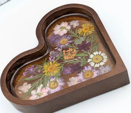 Heart-shaped resin jewelry tray with pressed dried flowers and dark wood border
