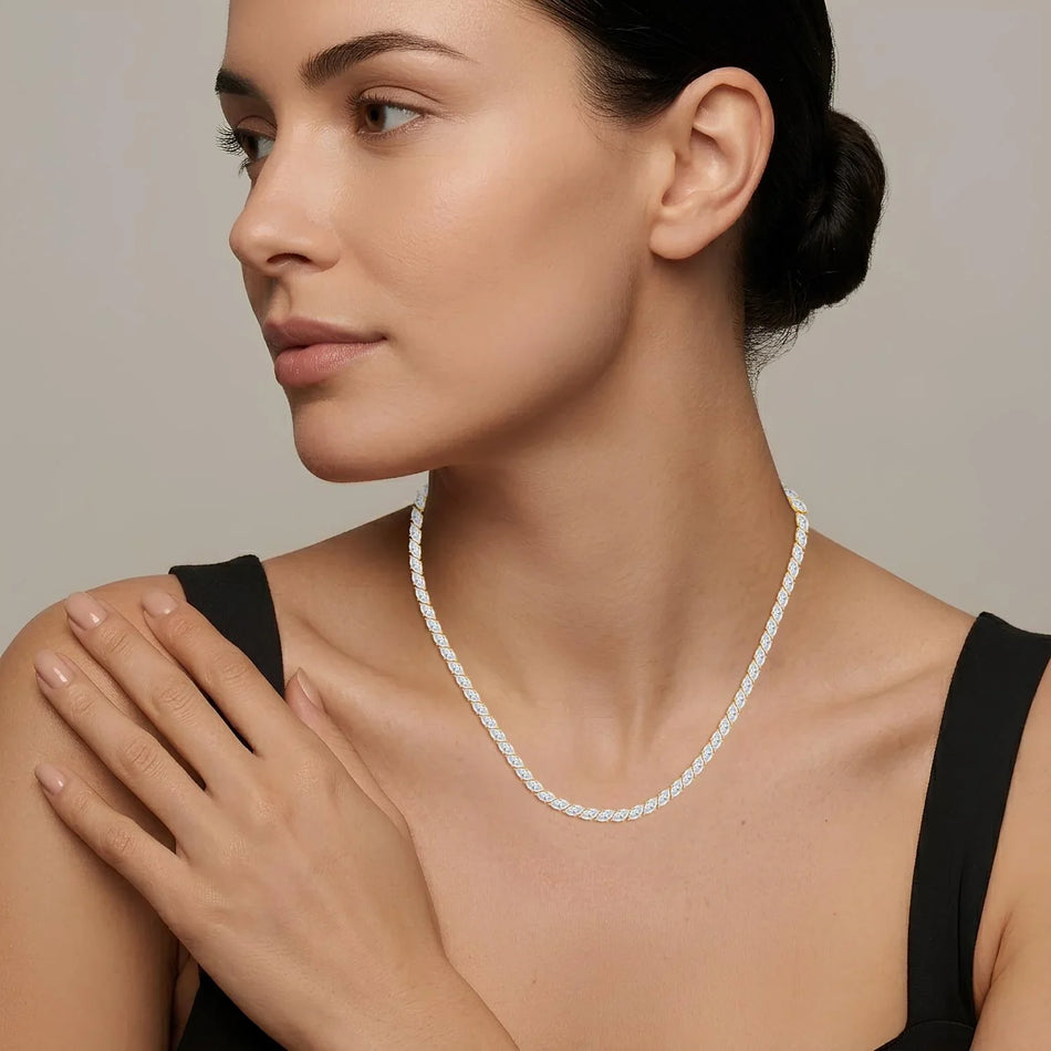 Elegant diamond tennis necklace with marquise-cut stones, worn by woman in black top, perfect for engagement or custom jewelry designs.