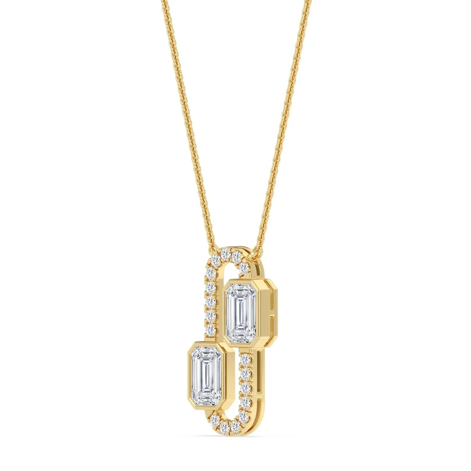 Elegant gold pendant necklace with emerald-cut diamonds and diamond accents, perfect for custom jewelry designs.