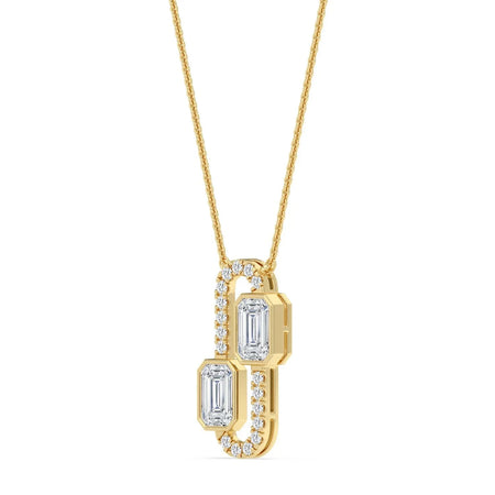 Elegant gold pendant necklace with emerald-cut diamonds and diamond accents, perfect for custom jewelry designs.