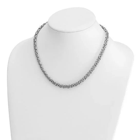 Silver Celtic knot chain necklace displayed on a white jewelry bust.