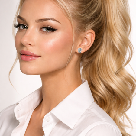 Woman wearing a white shirt and emerald-cut diamond stud earrings, custom jewelry