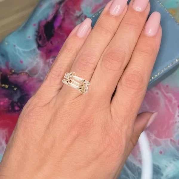 Gold multi-band engagement ring on hand, custom made-to-order jewelry design