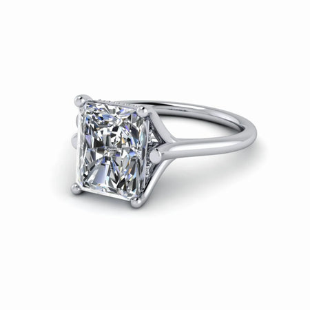 Radiant cut diamond solitaire engagement ring with prong setting on white gold band