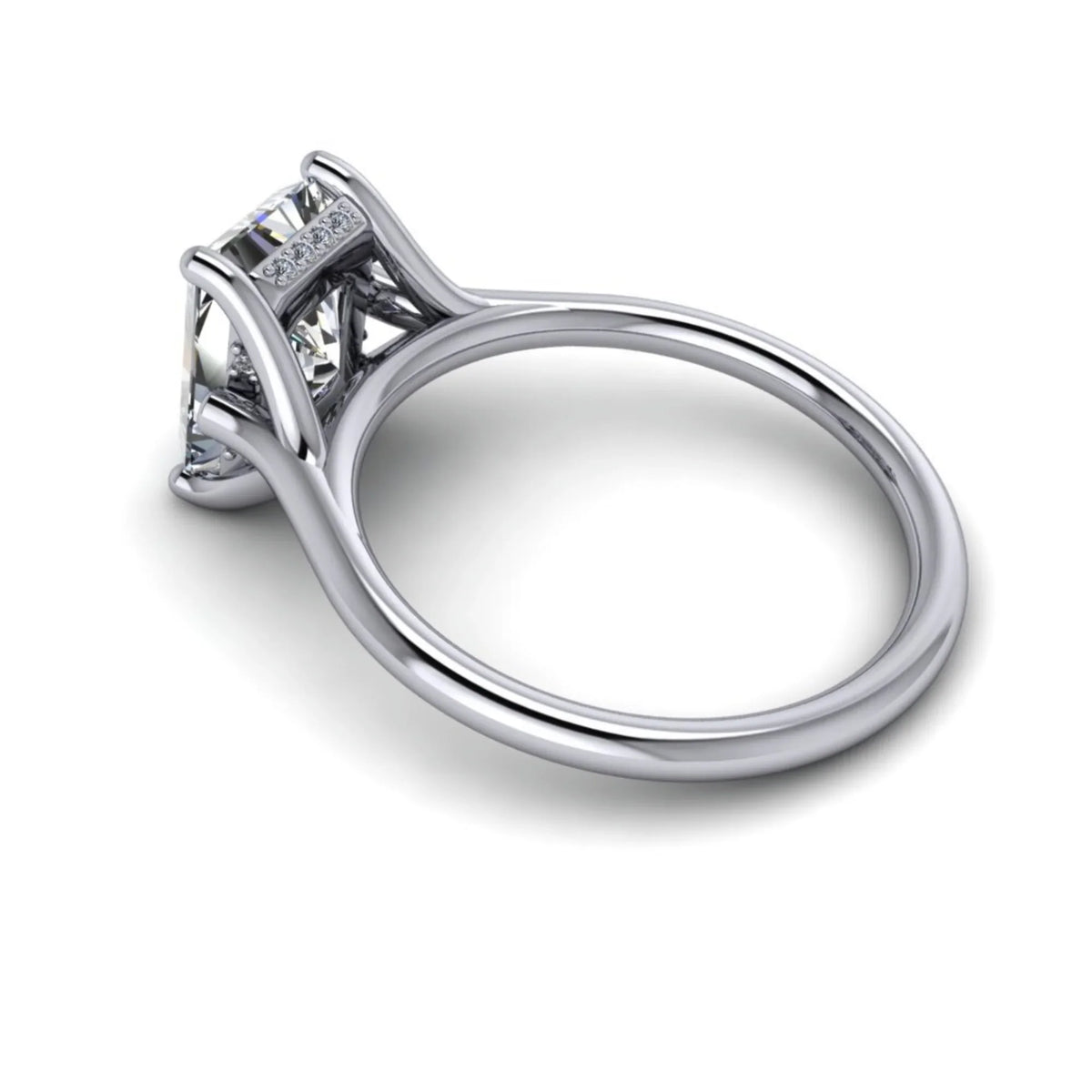 Platinum solitaire engagement ring with pavé diamond accents and a raised prong setting