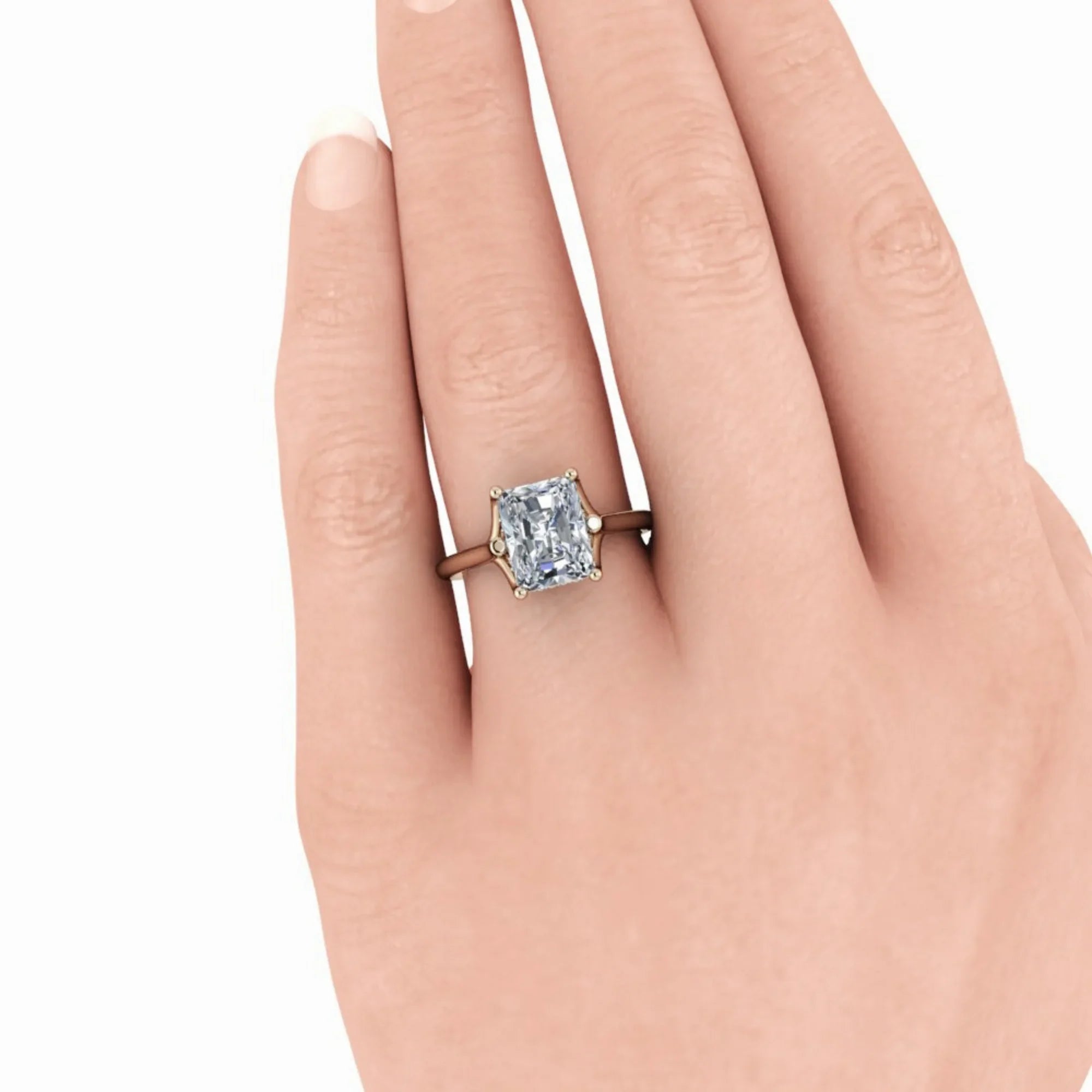 Radiant cut engagement ring with solitaire diamond on gold band on hand