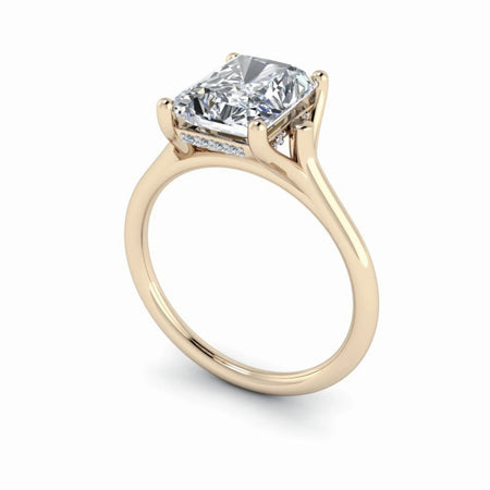 Yellow gold engagement ring with a rectangular cushion-cut diamond solitaire