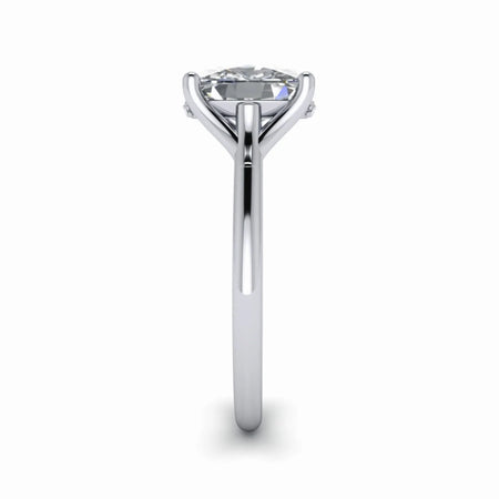 Side view of solitaire engagement ring with round diamond and sleek white gold band