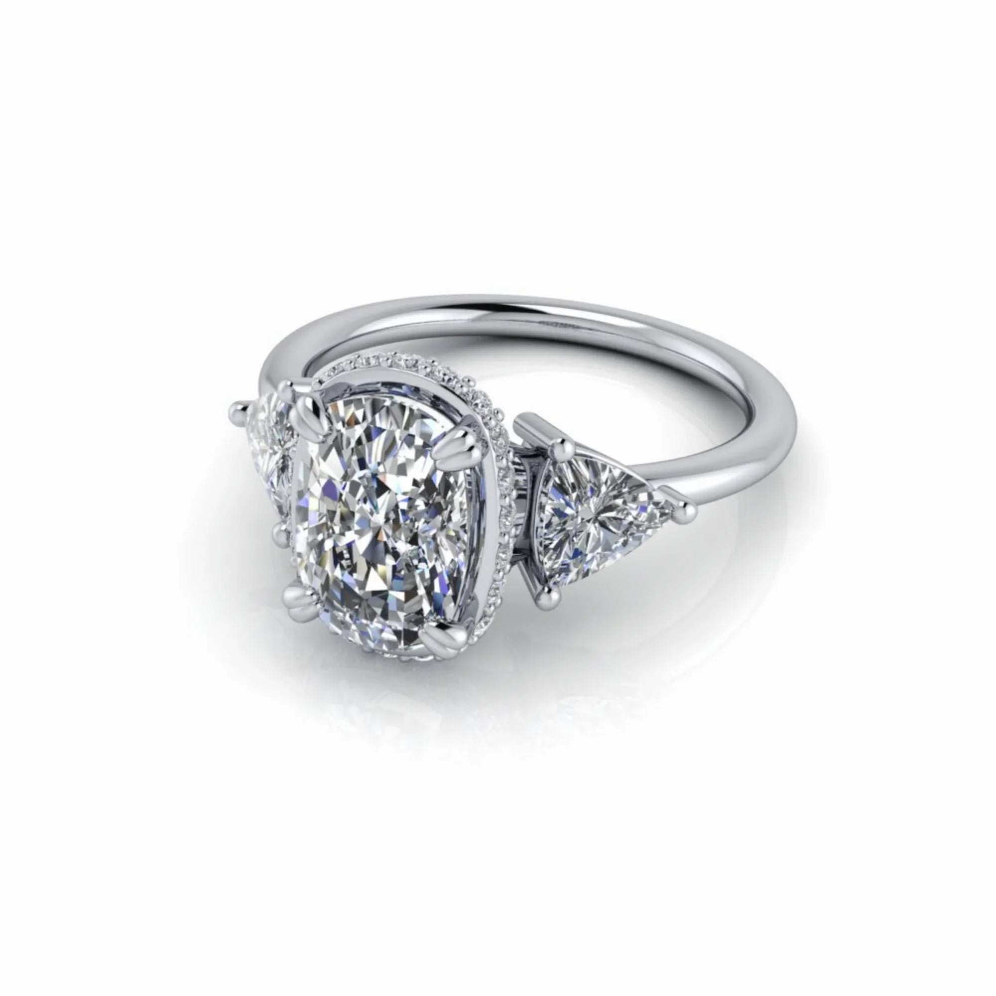 Oval diamond engagement ring with side stones in white gold setting on white background