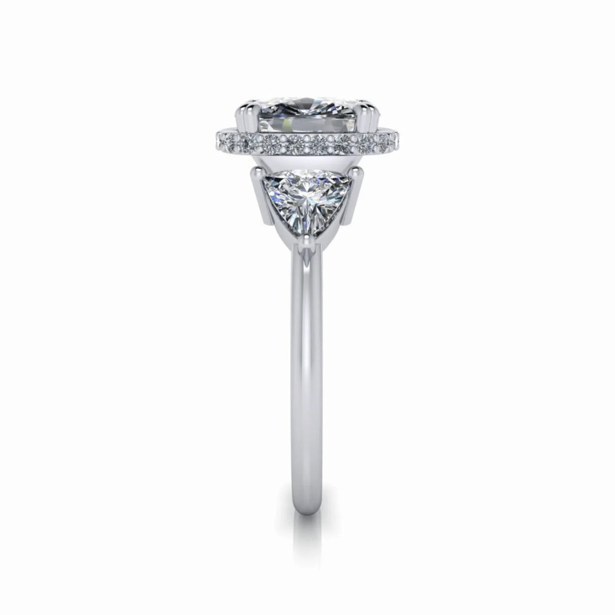 Side view of a custom white gold engagement ring with halo and triangular side diamond