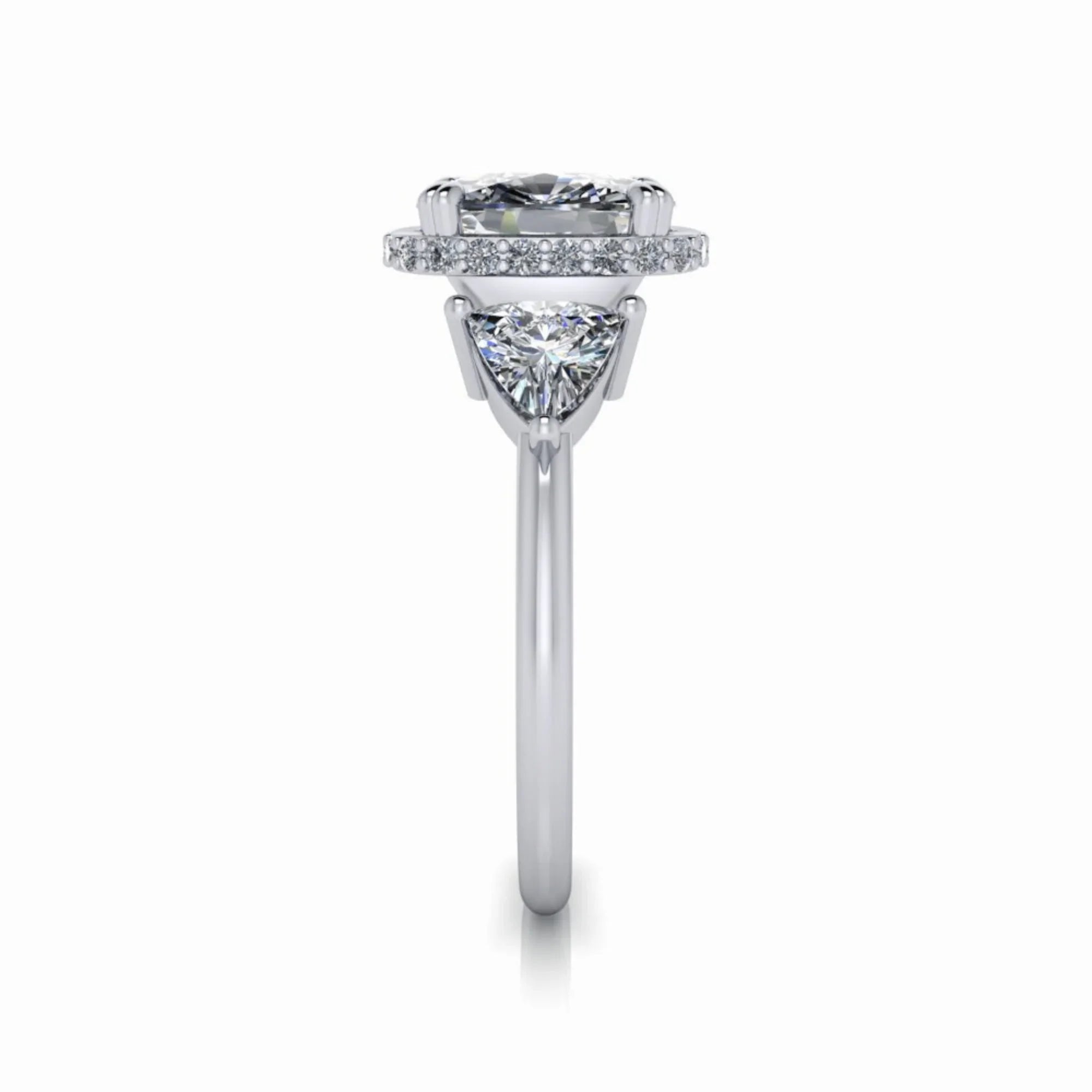 Side view of a custom white gold engagement ring with halo and triangular side diamond