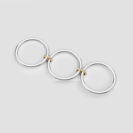 Elegant interlocking rings with diamonds and gold accents, perfect for custom engagement jewelry.