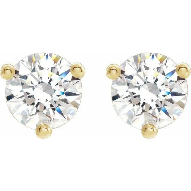 Round diamond stud earrings in gold prong settings