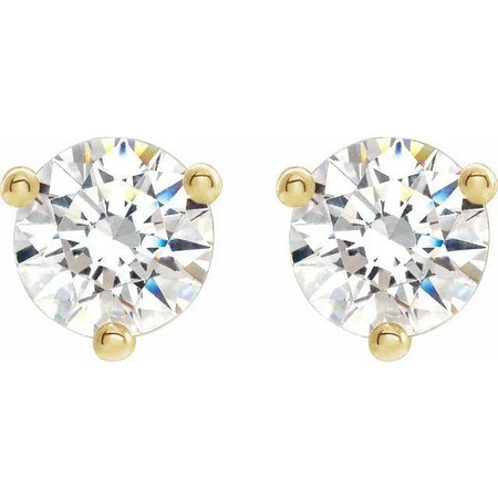Round diamond stud earrings in gold prong settings