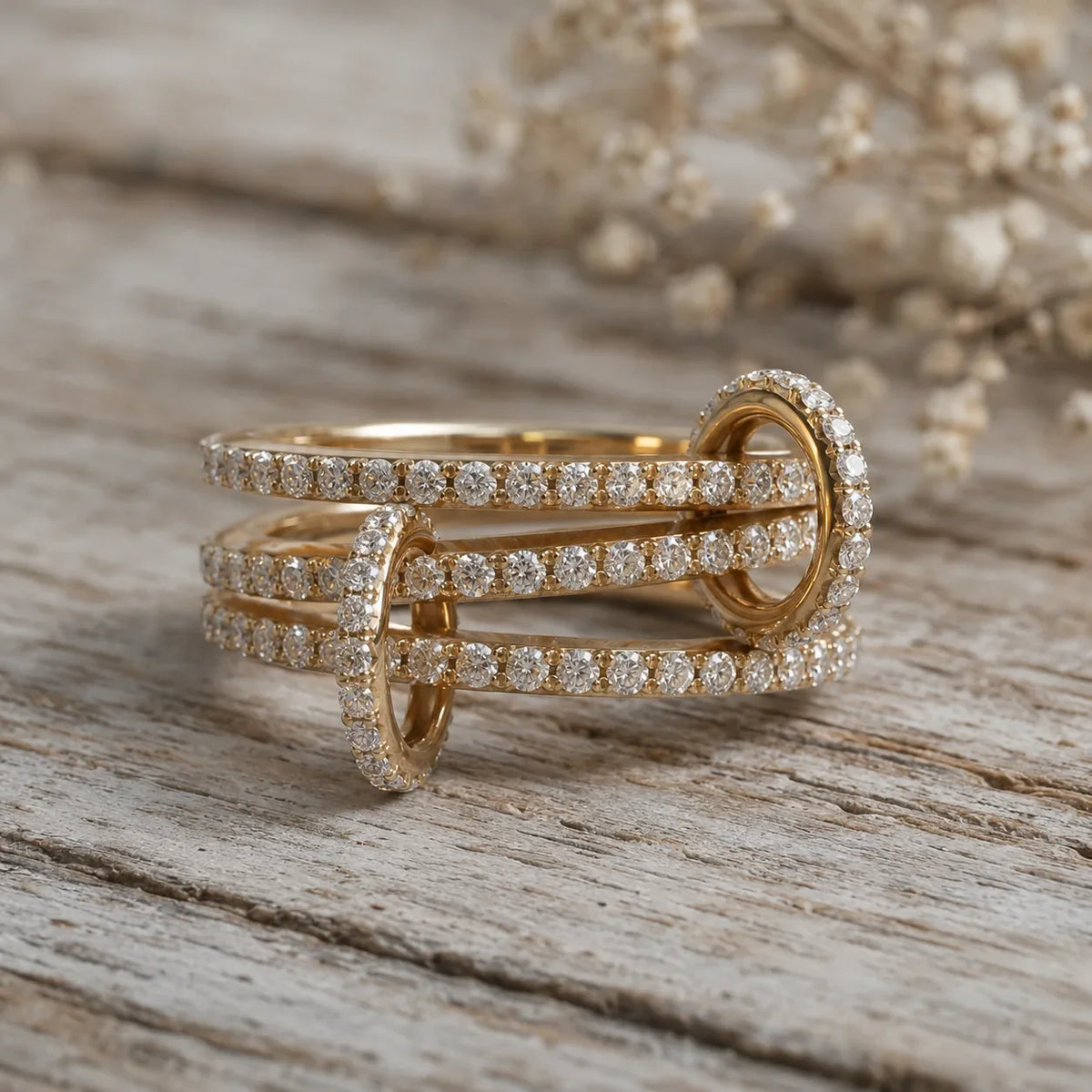 Elegant gold diamond engagement ring with intertwined bands, perfect for custom wedding jewelry designs.