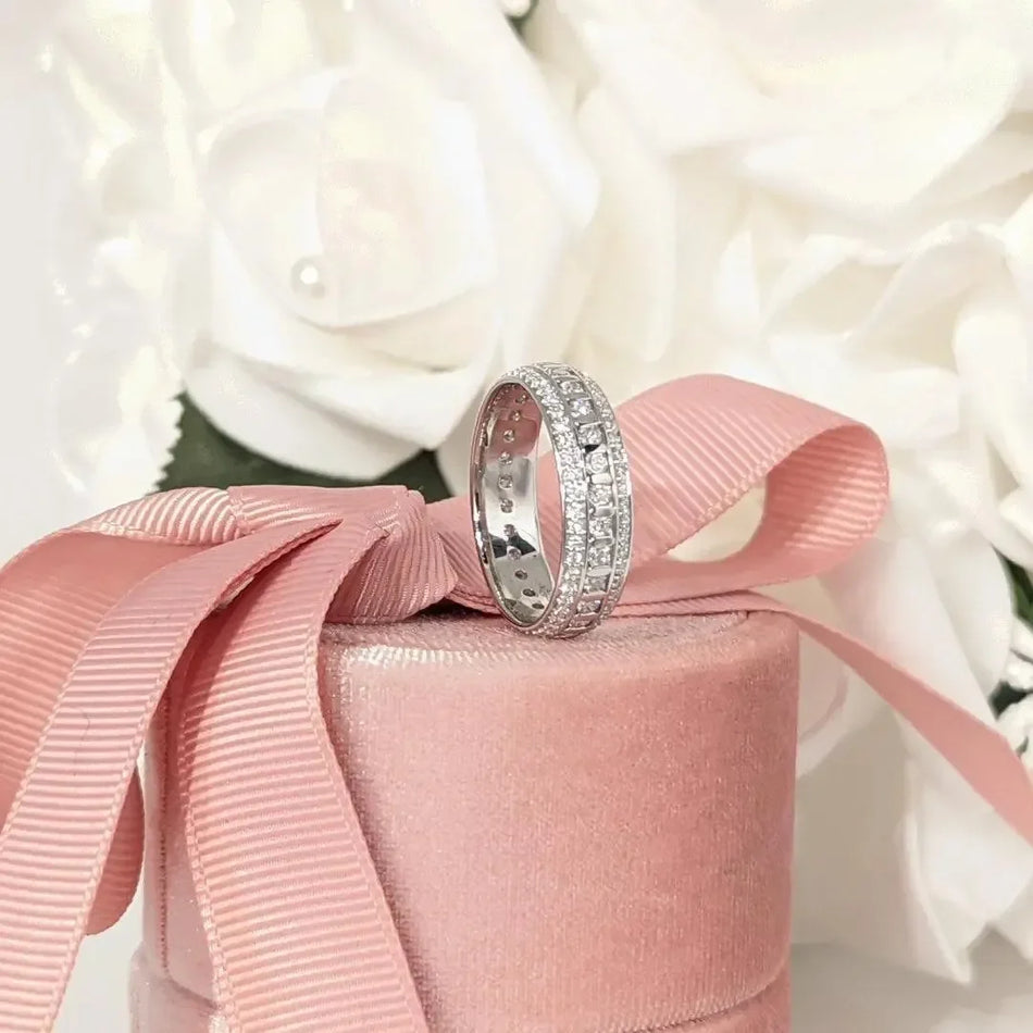 Men's lab grown diamond band ring on pink velvet box with white flowers