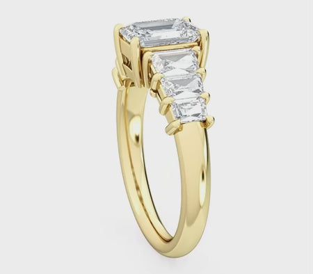 a three stone ring with a baguette cut diamond