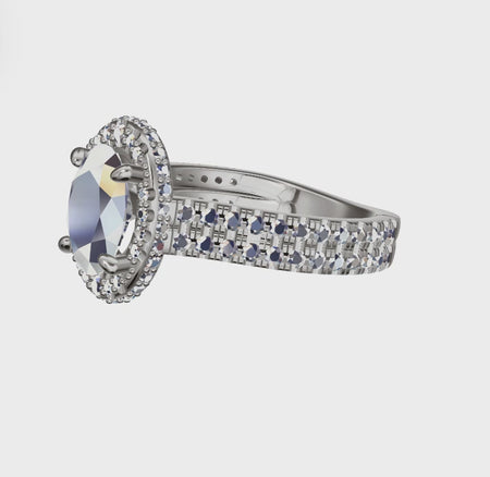 a ring with a blue stone surrounded by white diamonds