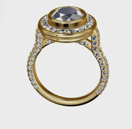 a gold ring with a black diamond surrounded by white diamonds