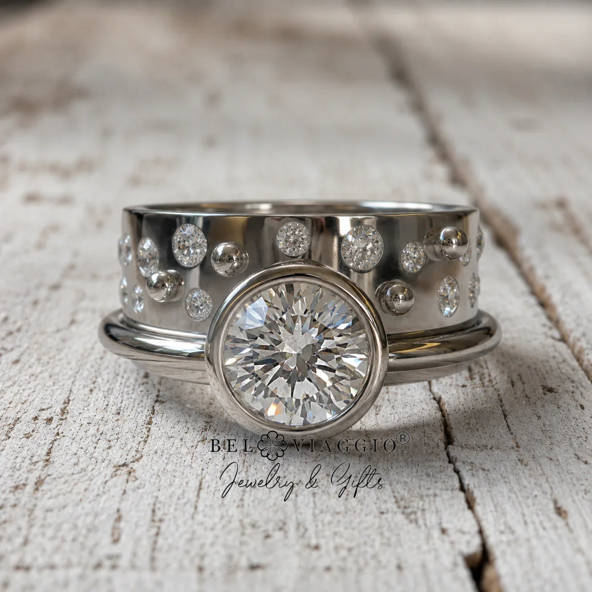 Custom engagement ring with round diamond center and pavé side stones on rustic wood