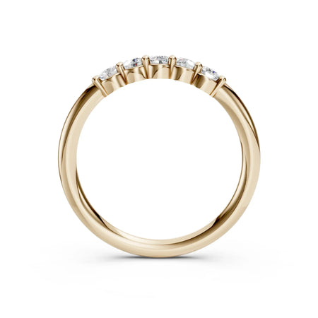 Yellow gold band with five round diamonds in a prong setting, custom engagement ring