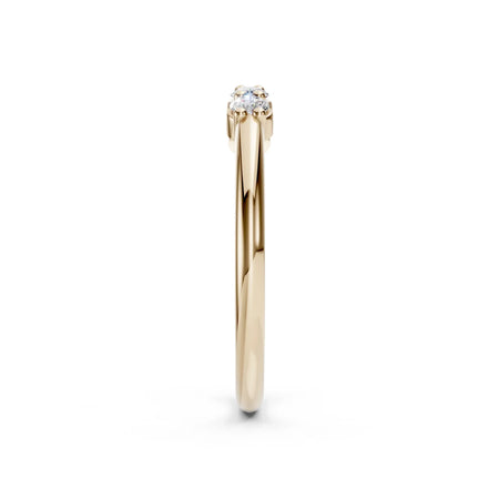 Yellow gold solitaire engagement ring with round center diamond, viewed from the side